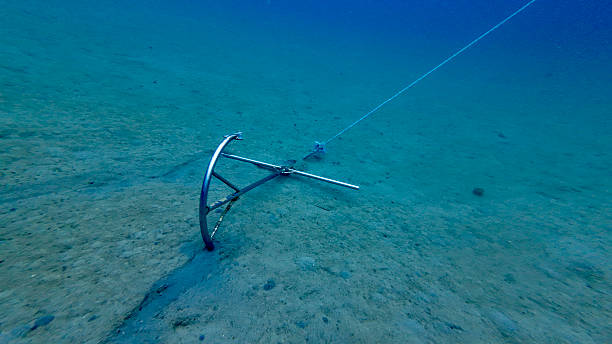 istock Anchor on the sandy bottom of the sea. 2214863712