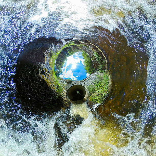istock Little Planet rabbit hole 360 image of bridge over river. shot from midway. 2214864012