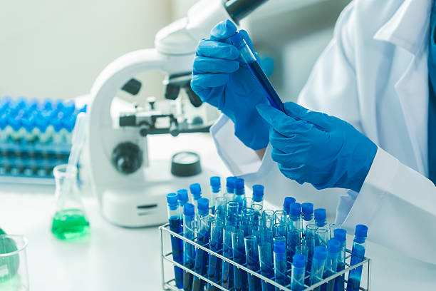 istock Scientists and microscopes for medical research, innovation or analysis in science or biology laboratories for vaccines. 2214868435