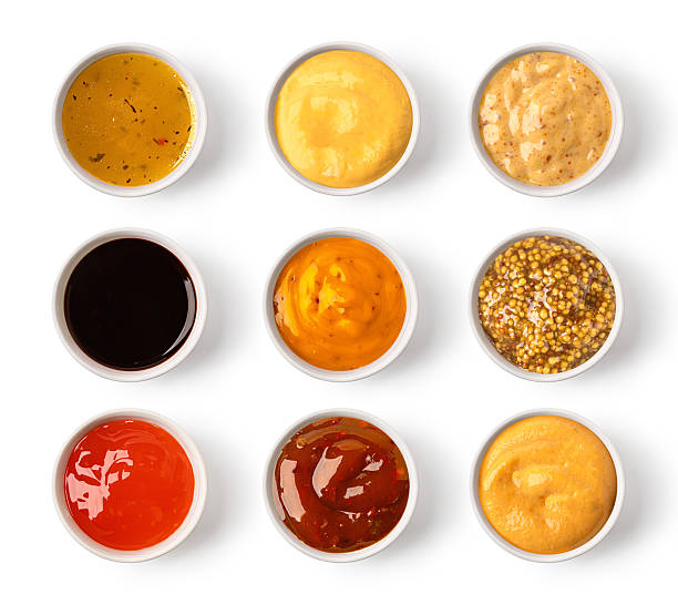 istock Set of various sauces in bowls, isolated on white background, top view 2214869977