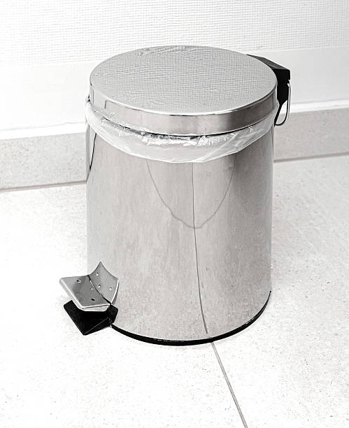 Small metal trash can with pedal in the bathroom