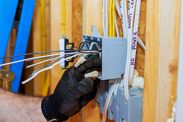 istock Electrician working on wiring connections in a residential construction site during daylight hours 2214870788