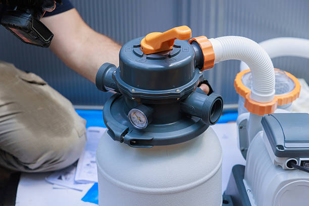 istock Detailed view of pool filter system installation in home setting during daytime 2214870810