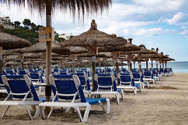 People sunbathing at Playa de la Malagueta, a beach in the Centro district of the city of Málaga, in Andalusia, Spain. It is an popular urban beach about 1200 meters long.