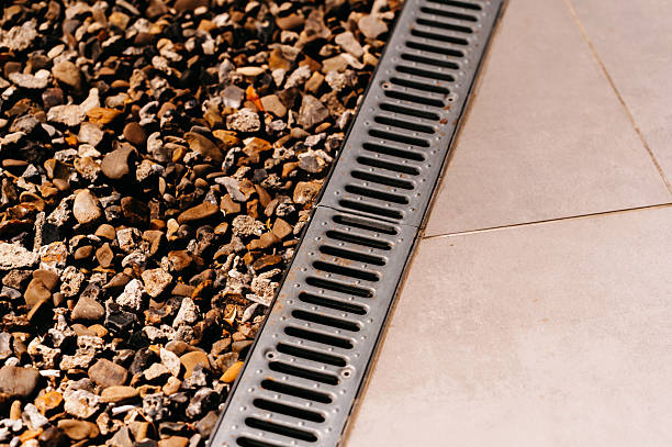 A Drainage Grate Featuring Stylish Decorative Gravel Combined with a Beautiful Tile Floor