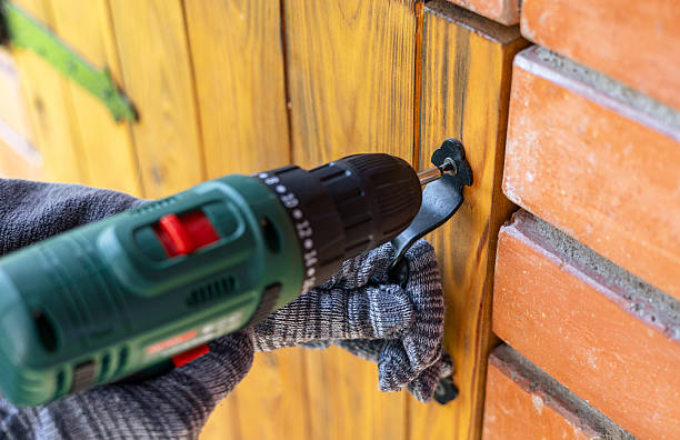 istock Screwing screws using an electric screwdriver. Assembling furniture using a cordless drill-screwdriver. Modern technologies in construction. 2214878219