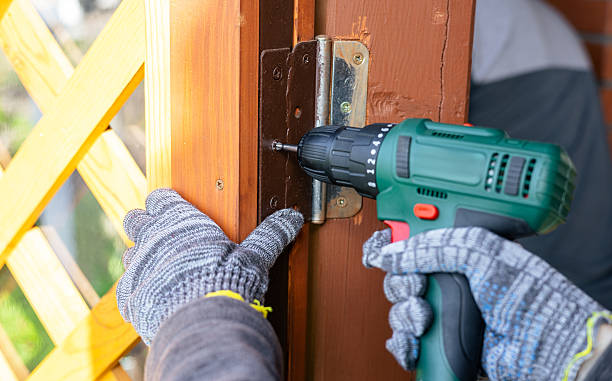 istock Screwing screws using an electric screwdriver. Assembling furniture using a cordless drill-screwdriver. Modern technologies in construction. 2214878575