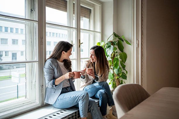 istock Two businesswomen enjoying a coffee break by the window 2214879426