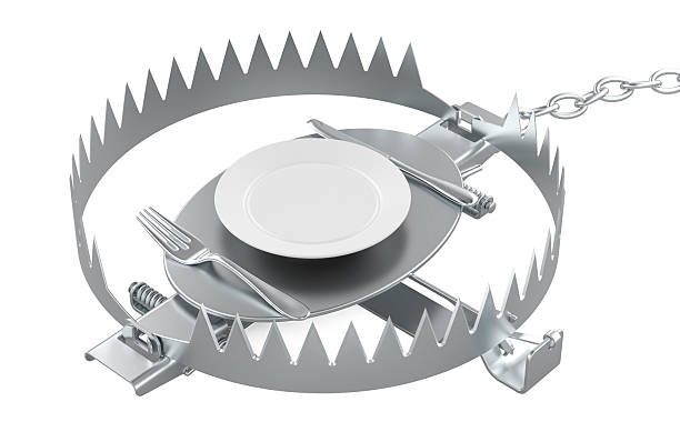 istock Bear trap with plate, knife and fork. Diet concept, 3D rendering 2214879789