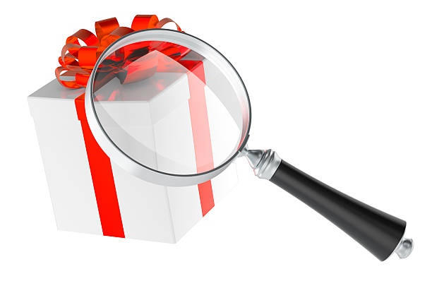istock Magnifying glass with gift box. Gift search concept. 3D rendering 2214880012