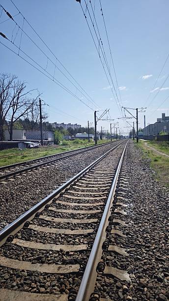 istock Railroad tracks with electric wires 2214880871