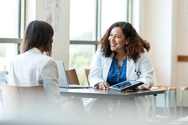 istock Doctor and Patient Consulting with Digital Tablet 2214881075