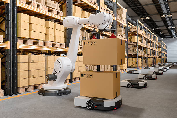 istock Smart Warehouse With Robot Arm Putting Cardboard Boxes On AGV 2214881166