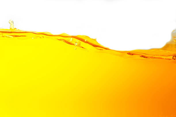 Freshly squeezed orange juice from the farm with waves and bubbles, smooth and healthy.