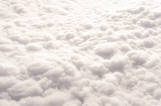 Looking down at a large area of soft cloud.