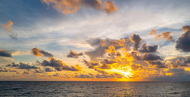 istock Sky at sunset. Sunrise over horizon. Sunset through clouds on sky. Twilight sky with sunset colors. Peaceful dawn with soft light. Dramatic dusk sunset with clouds. Sunshine in clear sky. 2214887976