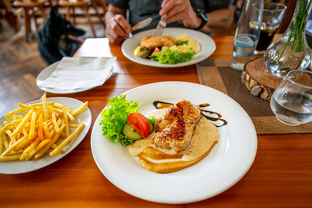 Pork schnitzel with a mushroom sauce and fries