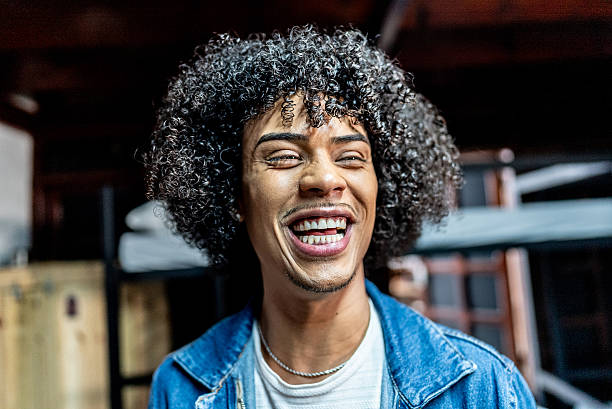 istock Happy young man at hostel room 2214898765