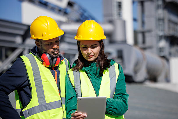istock Industrial professionals reviewing digital plans on a digital tablet 2214904806