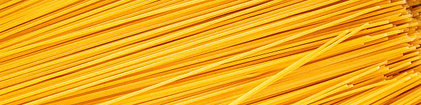 istock Spaghetti pasta raw durum wheat ingredient fresh dish on the table rustic food top view copy space food background 2214904886