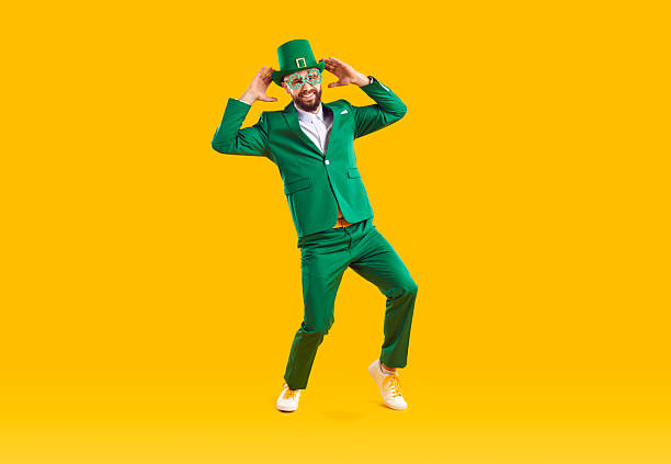 istock Happy funny guy in green suit and leprechaun hat having fun on Saint Patrick's Day 2214908823