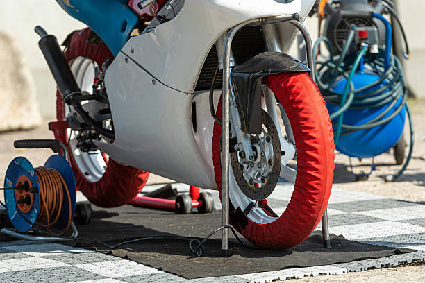 istock Motorcycle preparation with tire protection covers in an outdoor setting 2214909264