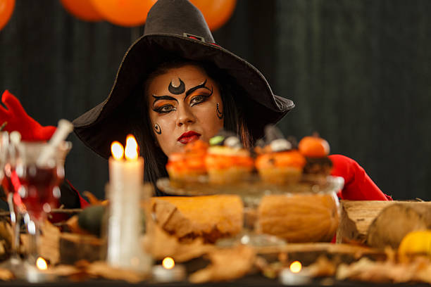 A close up of a nasty witch with an evil stare.