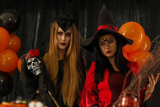 woman in red wig and costume celebrates Halloween