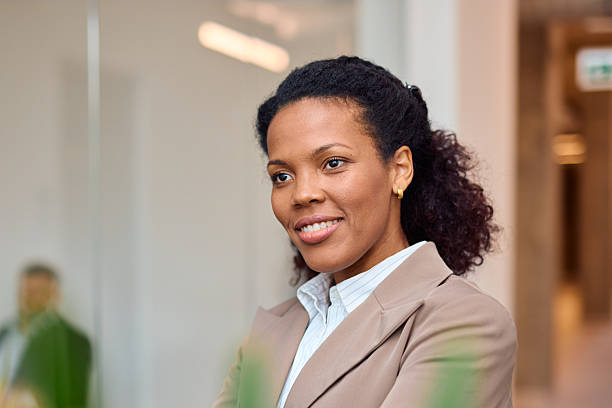 istock Confident businesswoman smiling in modern office 2214923459