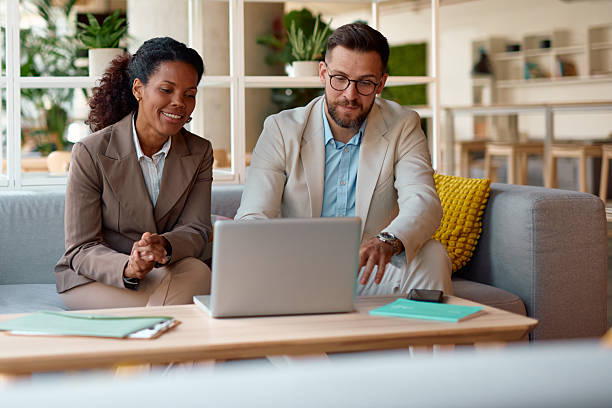 istock Business partners working together on a laptop in a modern office 2214925830