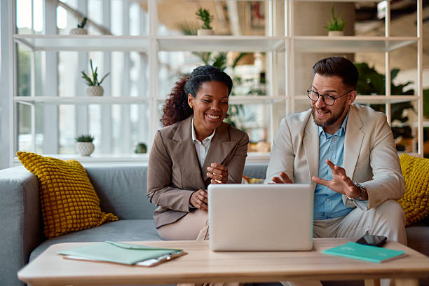 istock Business partners having a video call on laptop in modern office 2214925870
