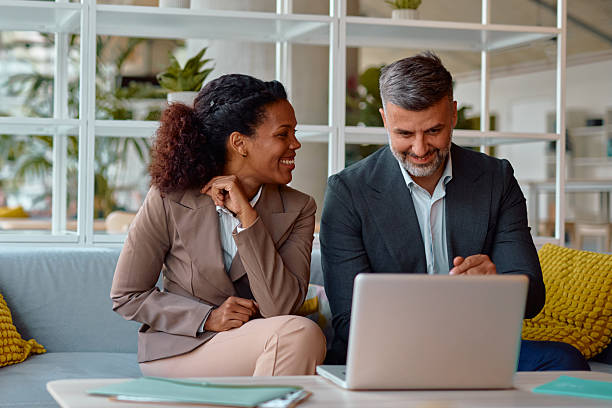 istock Business partners working together on a laptop in a modern office 2214926030
