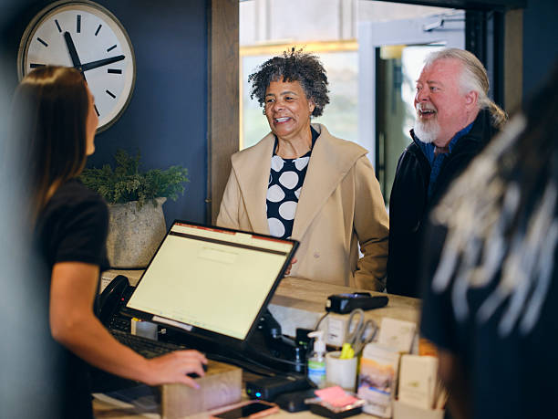 istock Senior Aged Couple Checking In to a Hotel 2214926652