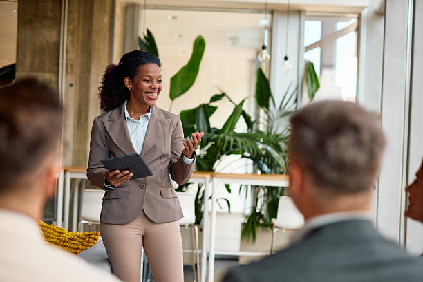 istock Confident businesswoman leading a presentation in a modern office 2214926827
