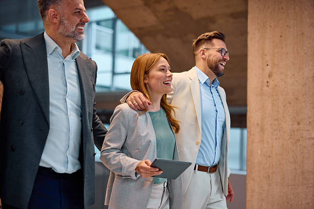 istock Business team walking and talking in modern office building 2214926957