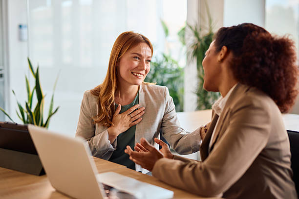 istock Two businesswomen discussing and collaborating in a modern office 2214929083