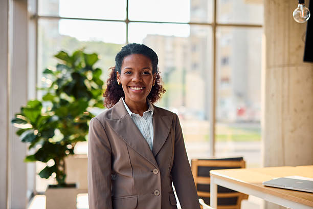 istock Confident businesswoman smiling in modern office 2214929165