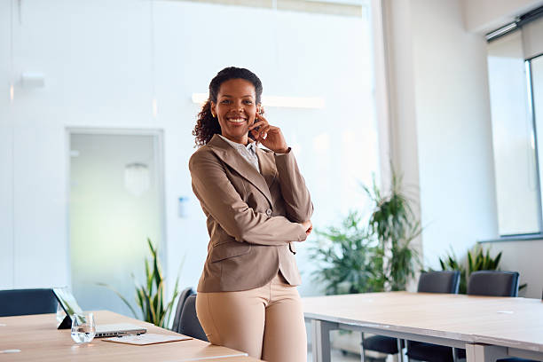 istock Confident businesswoman talking on smartphone in modern office 2214929184