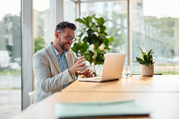 istock Businessman having a video call in a modern office 2214929976