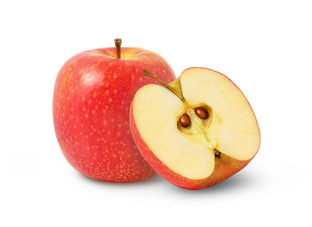 istock One pink lady apple and a half isolated on white background. Red apples with clipping path. 2214931300