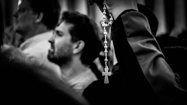 Rome, Italy– 08 May 2025:A crucifix in the hands of a believer