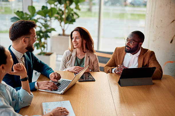 istock Business team having a meeting using laptop and tablet in the office 2214941348