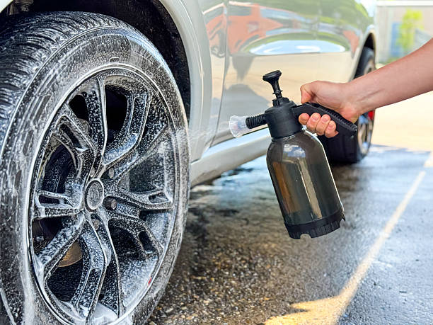 istock Car Wheel Cleaning with Foam and Pressure Sprayer 2214943748