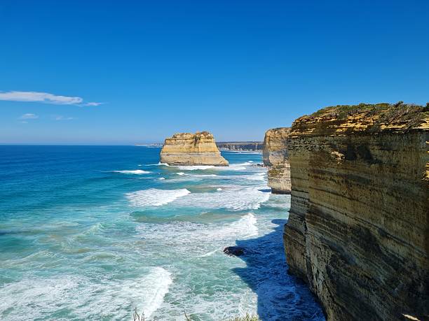 istock Coastal Cliffs and Sea Stacks under Clear Skies Ocean Road Victoria 2214943978