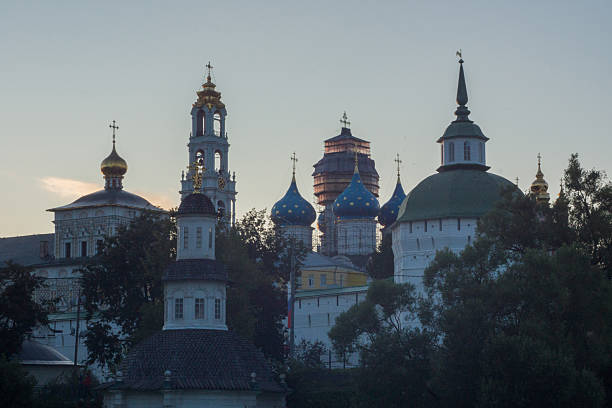 View of Lavra in Sergiev Posad in the dusk. In the foreground is visible top part of Chapel of the Pyatnitsky Well.