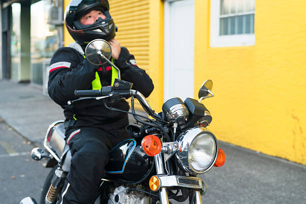 istock Man securing helmet with safety clip. 2214946127