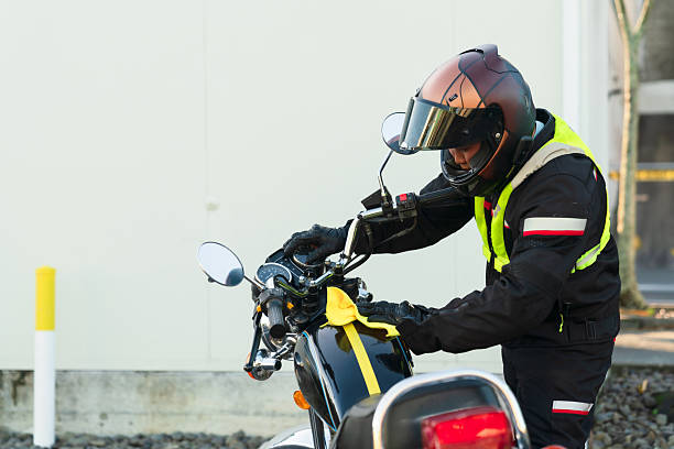 istock Man polishing motorcycle before riding. 2214946136