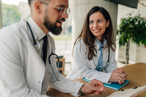 istock Two doctors having a friendly conversation in hospital cafeteria 2214947482