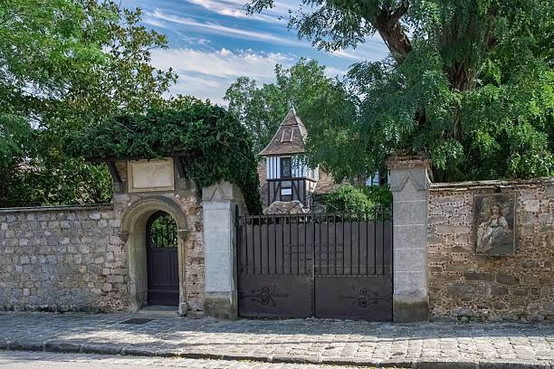 istock Old Stone Building with Gates in Barbizon 2214949515