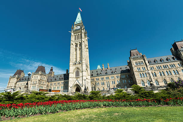 Queen Victoria statue , Parliament Hill and  Parliament buildings. Ottawa, Canada.